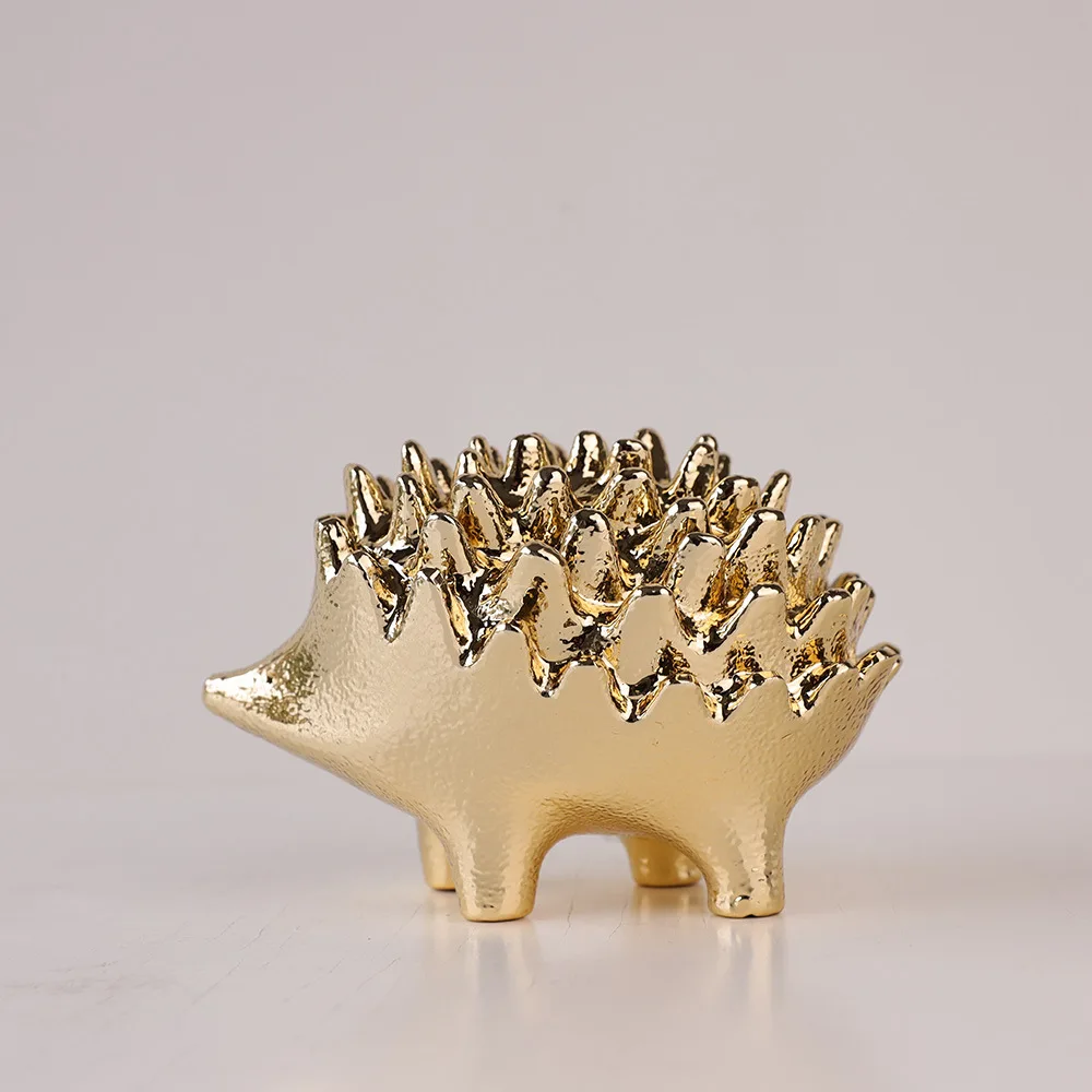

Modern light luxury metal hedgehog ornament, brass texture handicraft