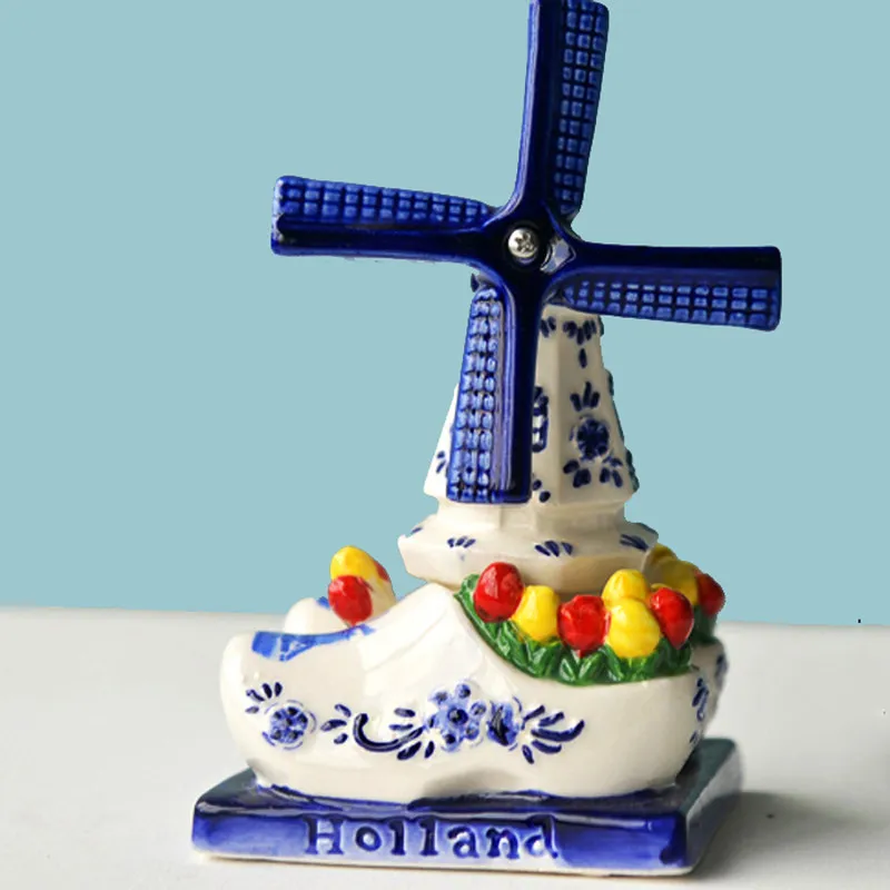 The blades will rotate. Dutch windmill ceramic handmade painting ornament