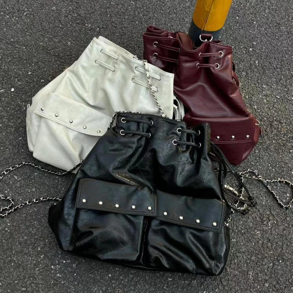 Fashionable Korean Niche PU Leather Rivet Drawstring Large Capacity Backpack Shoulder Bag Woman Bag Storage Bags School Bags