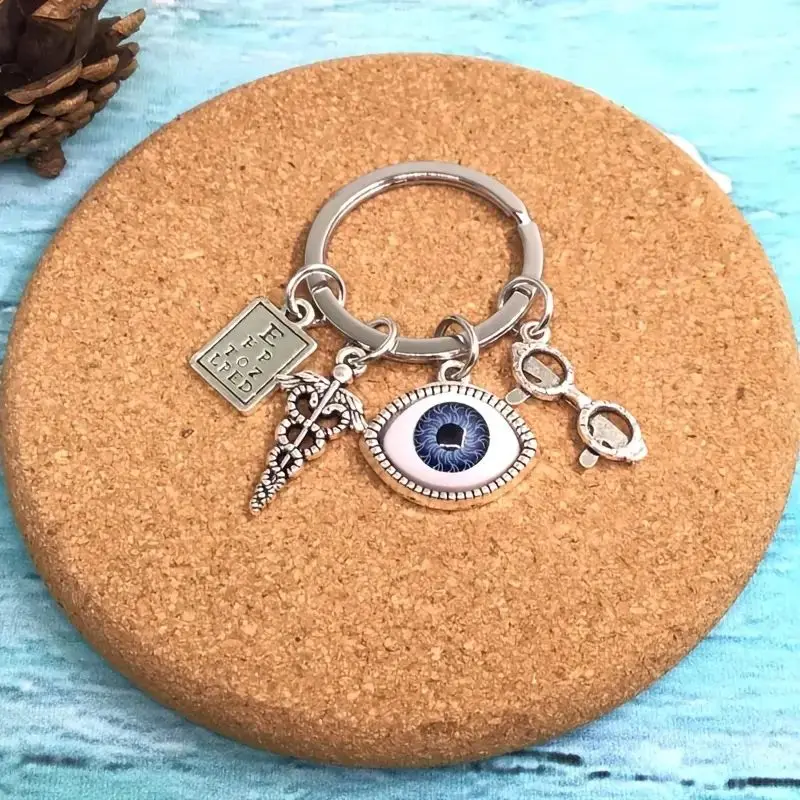 Silvery Charm Keychain With Eye Design, Optometry Themed Keyring With Charms, Unique Accessory For Bags And Keys