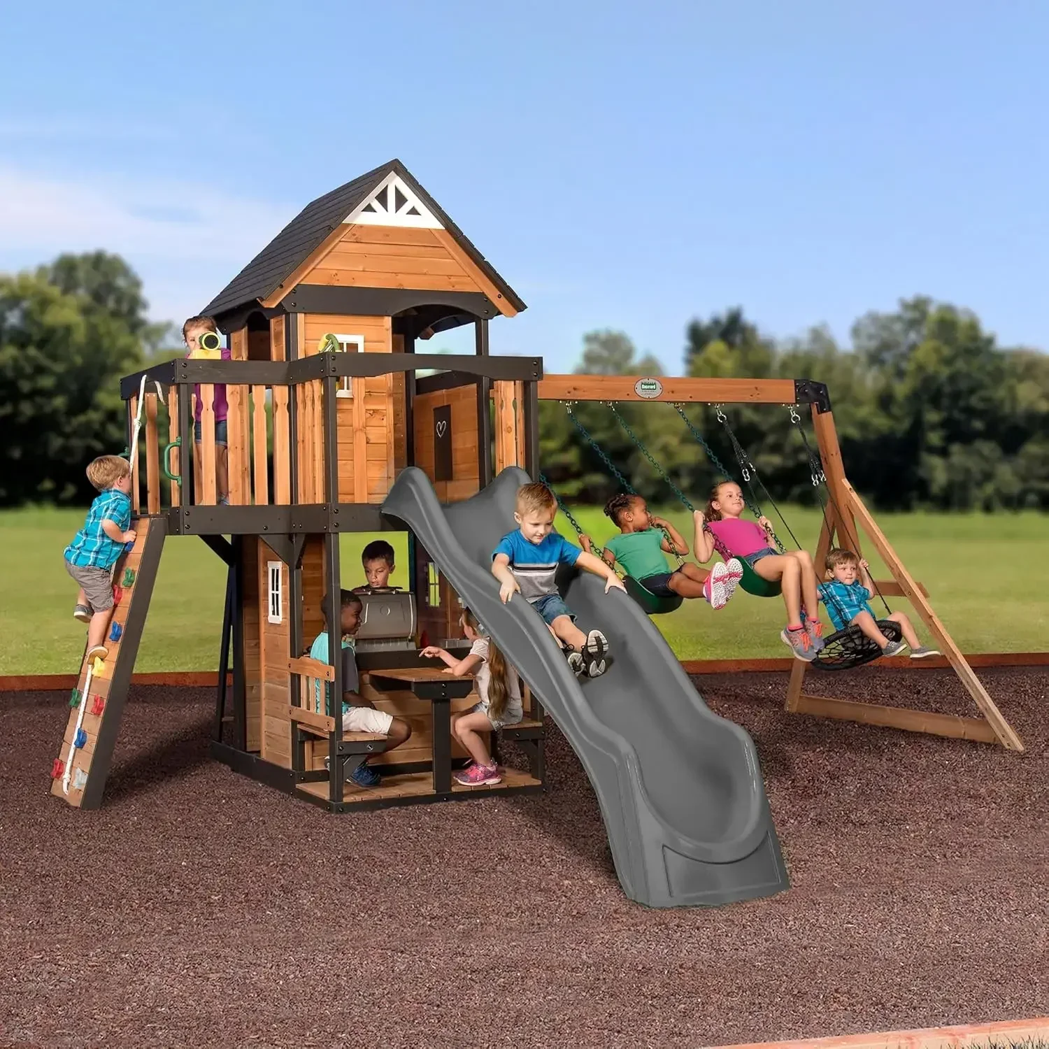 

Canyon Creek Cedar Wood Swing Set with Wave Slide, Clubhouse, Play Kitchen, Picnic Area, Belt Swings, Web Swing, Rock Wall,