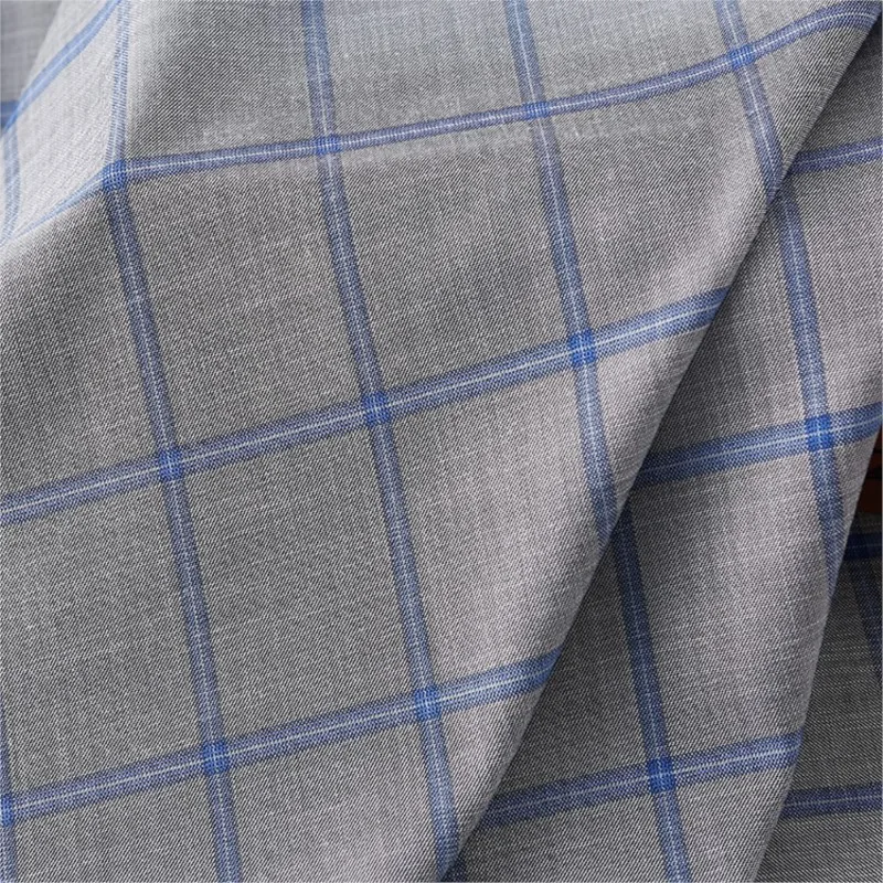 De stof voor modieuze heren- en damescasual pakken, werkkleding, rokken, broeken