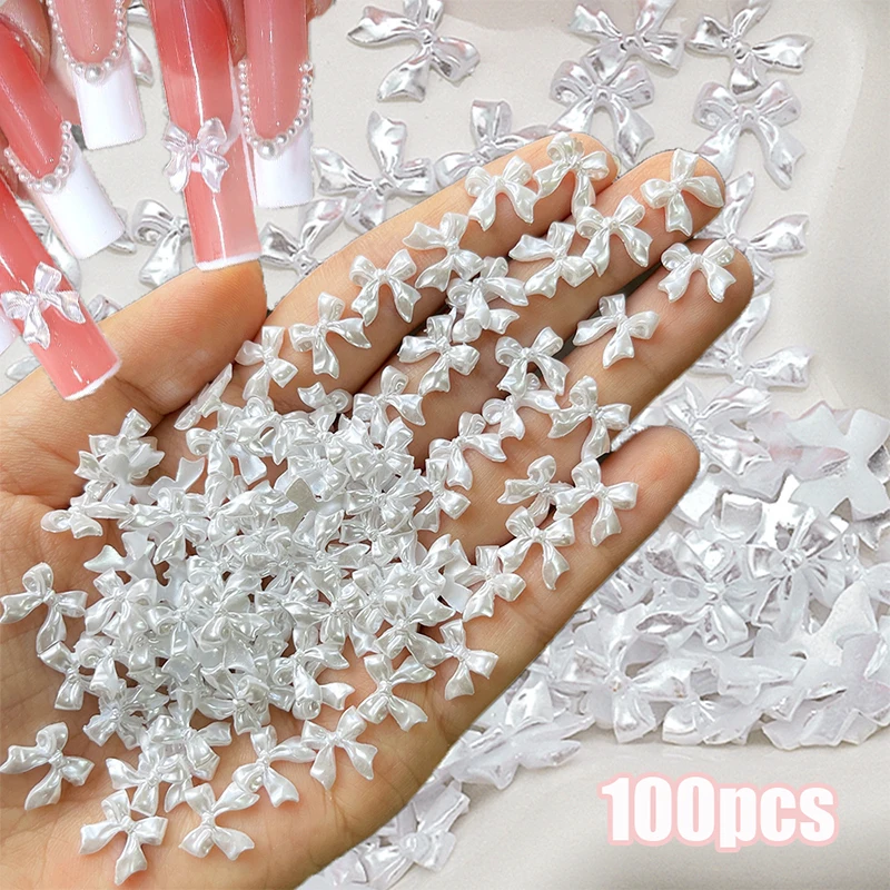 100 pièces couleur perle rose/blanc ruban nœud breloques pour ongles pièces Kawaii Aurora noeud papillon bijoux pour ongles 10*10mm décoration Nail Art Accesso