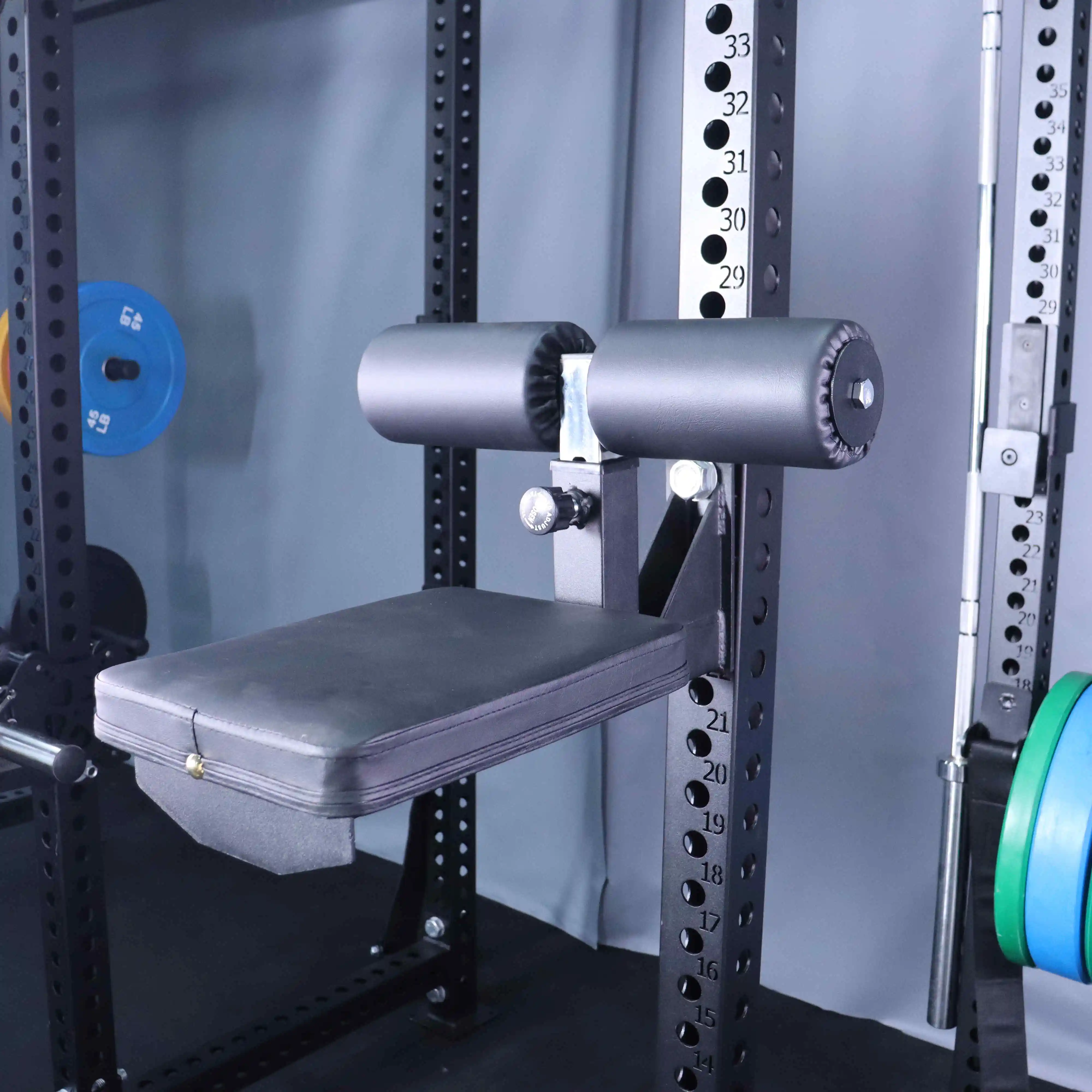 Drop-down seat mounted on squat rack - fitness accessories for sitting curls and exercises