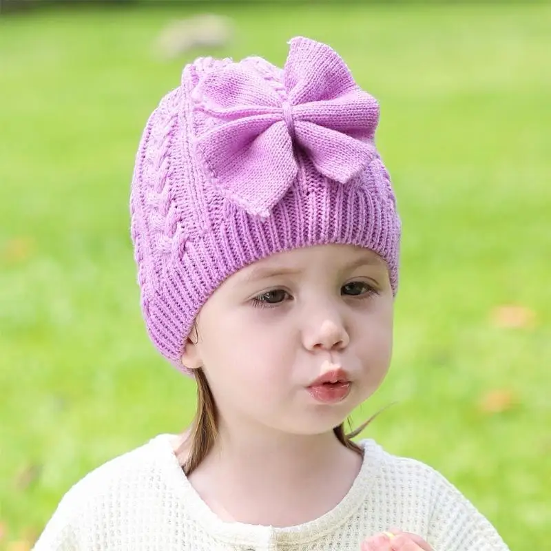Cappello lavorato a maglia in unita Cappello lavorato a maglia con fiocco per bambini Casual all'aperto Autunno e inverno