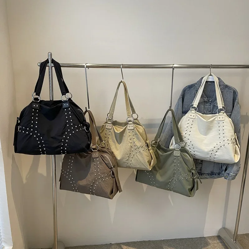 

2025 Autumn Popular Soft Cloth Rivet Shoulder Bag Fashionable Large Capacity Tote Bag Casual Versatile Commuting Underarm Bag
