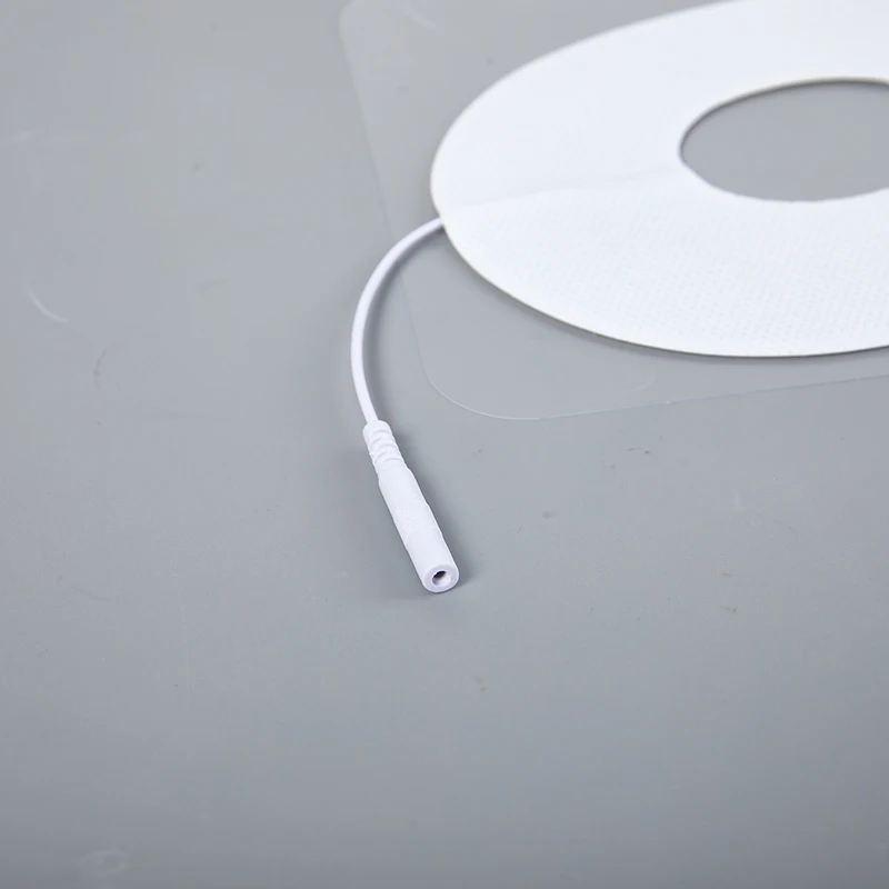 غير المنسوجة ذاتية اللصق EMS قناع عين غطاء عشرات القطب الوسادة لمدلك العلاج بالنبض الإلكتروني مع ثقب التوصيل