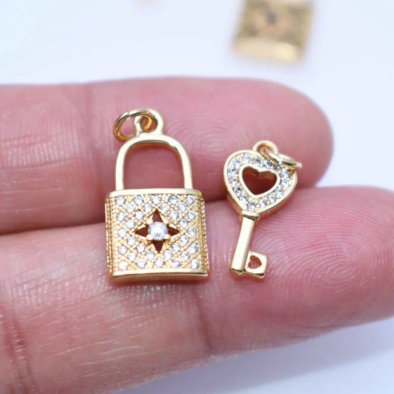 

Unique Design Anti Fading Gold Plated Copper White Black CZ Setting Grid Hollow Rectangle Lock Key Charms for DIYJewelry