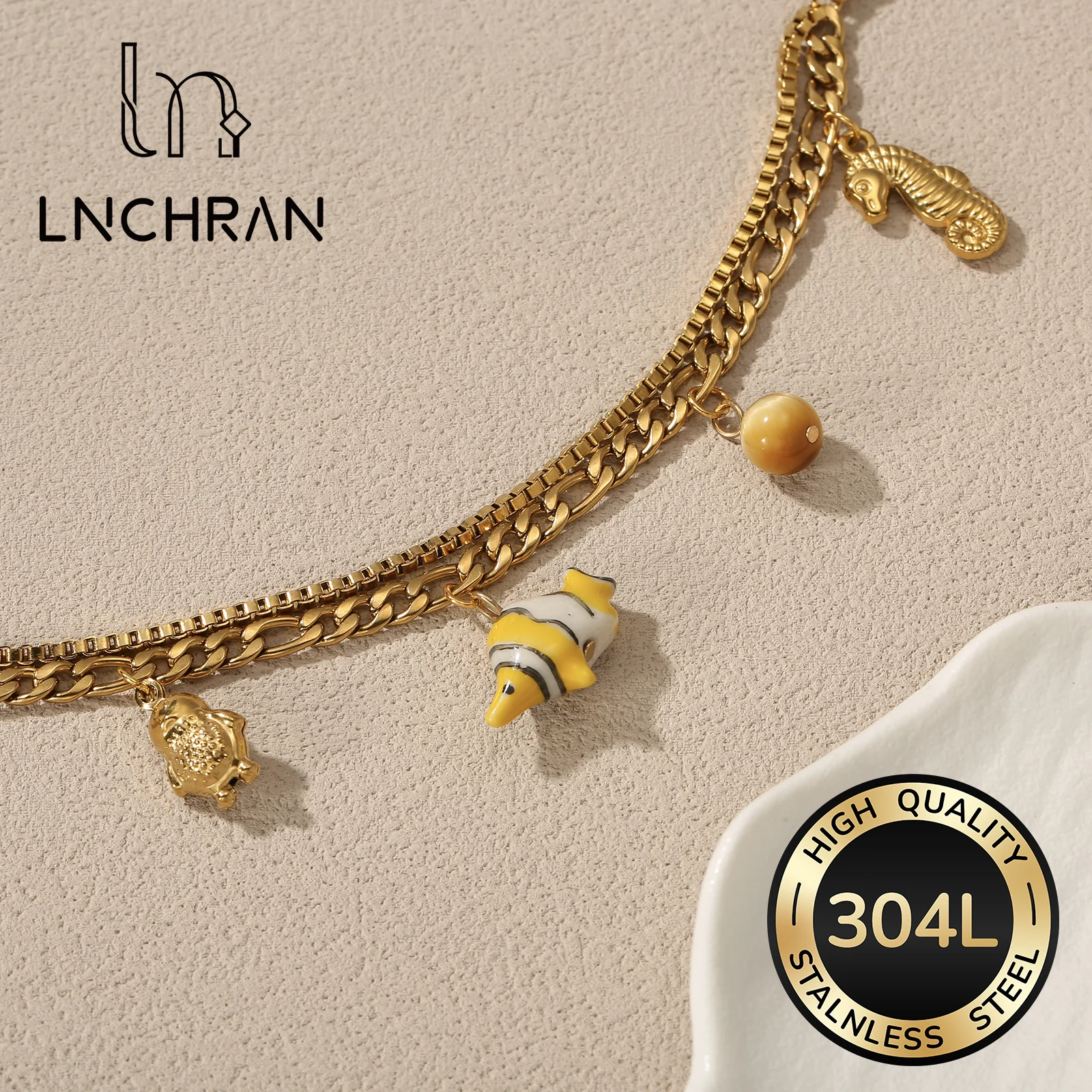 

Golden Tone Stainless Steel Ocean Charm Bracelet with Seahorse Fish and Whale Tail Pendants for Women