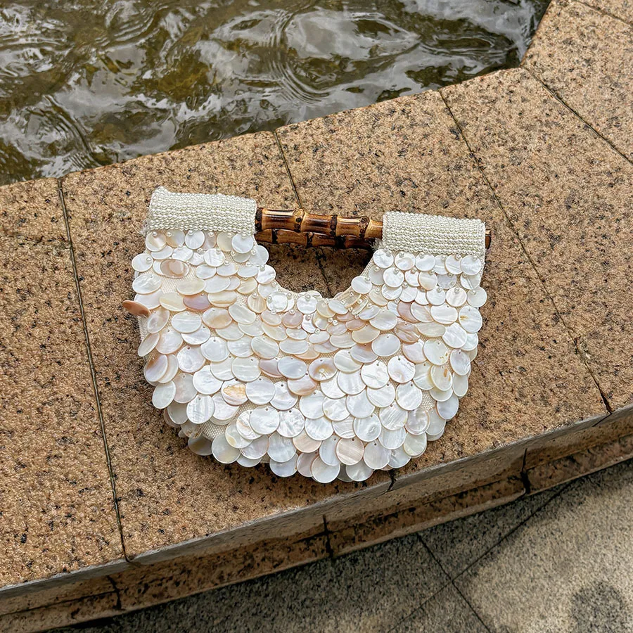 Spring and summer high-end pure handmade natural shell bag fairy niche design beaded bamboo portable girl bag
