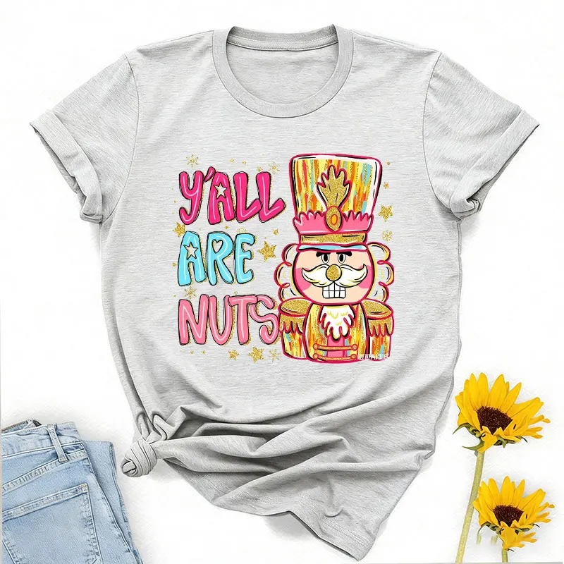 Y'all Are Nuts Coquette كسارة البندق Preppy عيد الميلاد Png السكر البرقوق الجنية المكسرات حول Brushstroke Crewneck تي شيرت مطبوع بلايز