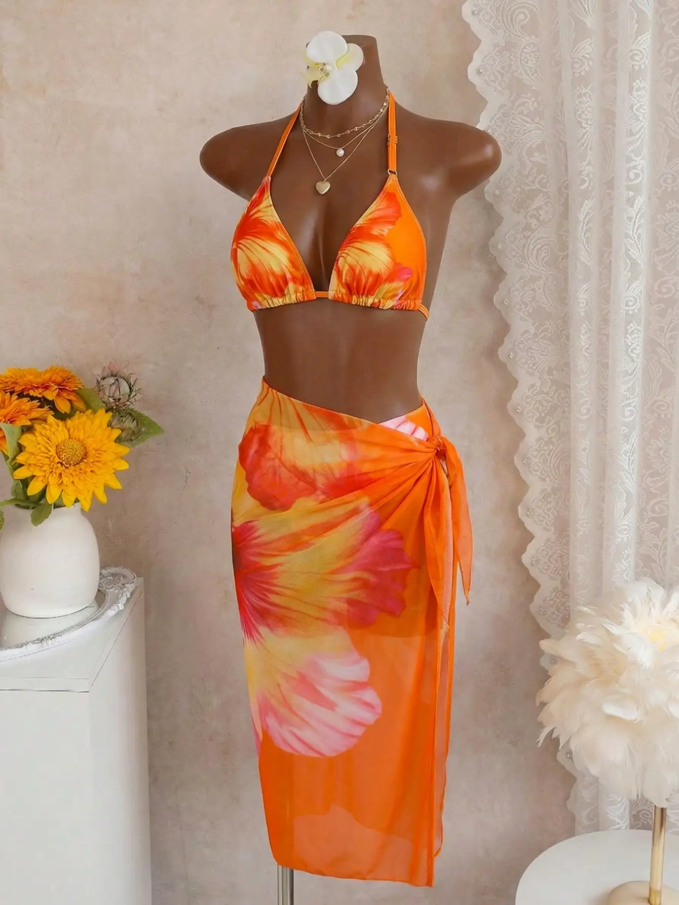 

Комплект купальника: оранжевый топ-бикини с цветочным принтом и юбка-парео