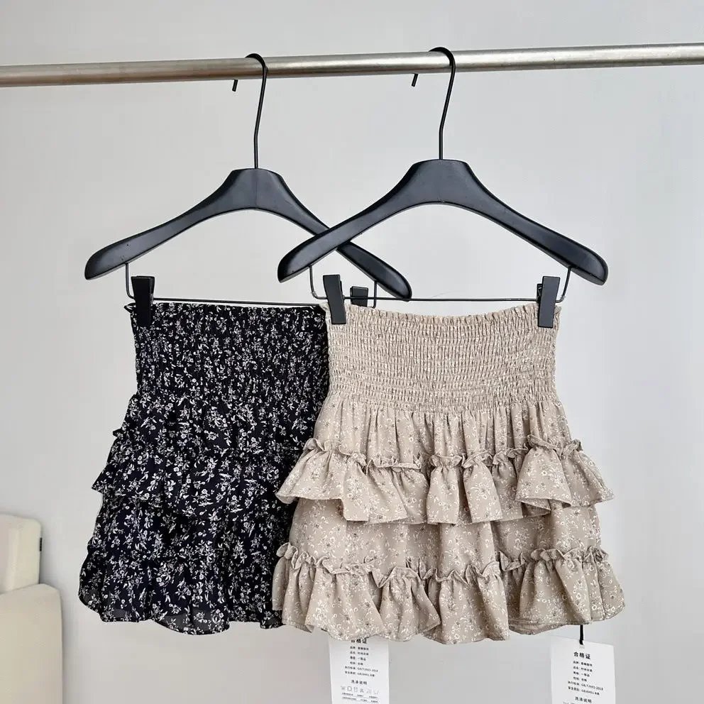 Kwiatowa spódnica do połowy długości 2025 nowa elastyczna wiosenna i letnia wysoka talia pokaż przerzedzająca brzuch mała czarna krótka spódniczka