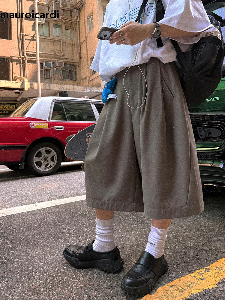 

Мужские свободные повседневные мягкие струящиеся шорты Mauroicardi на весну-лето, широкие, с эластичным поясом, длиной до икры, в корейском стиле