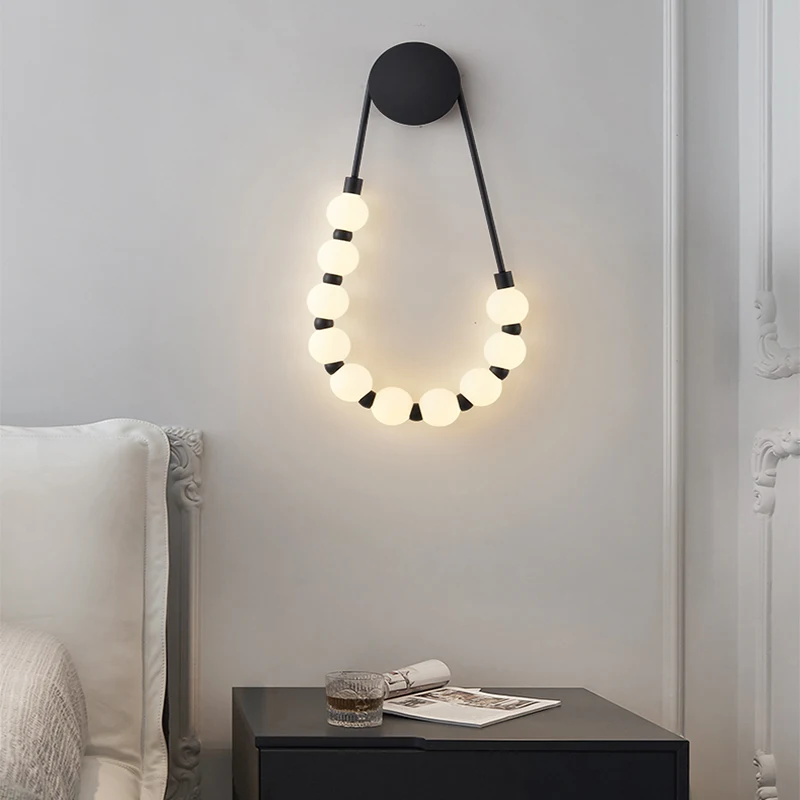 Modern simple bedroom bedside lamp Italian cream style living room creative design Asymmetric magic bean wall lamp