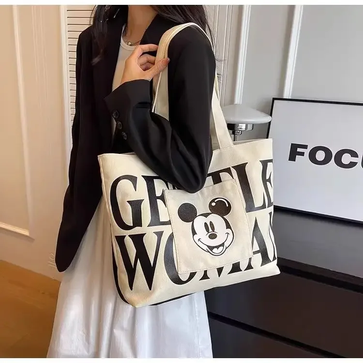 Disney 2025 New Mickey Large Capacity Canvas Bag Female Cartoon Versatile Shoulder Bag Student Class Commuting Tote Bag