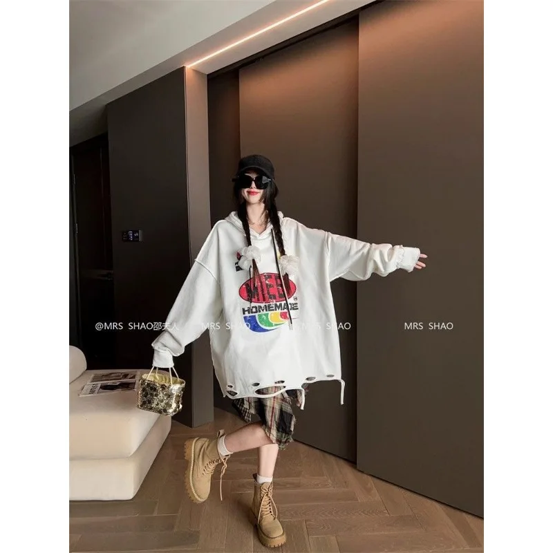 Felpa stampata a maniche lunghe con cappuccio casual allentata alla moda per le donne Top pullover di fascia alta autunno e inverno