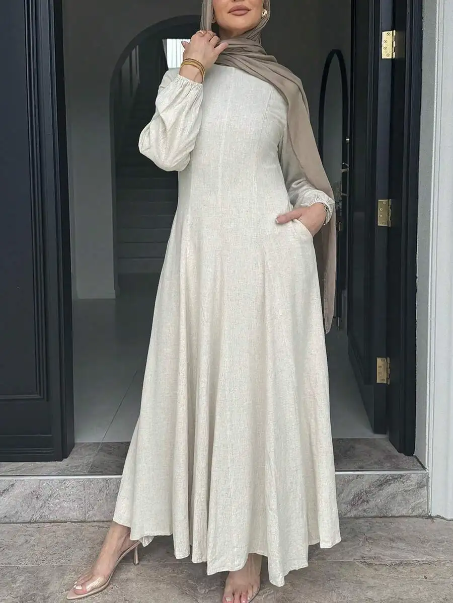 

Кремовое льняное платье макси А-силуэта с длинными рукавами и карманами