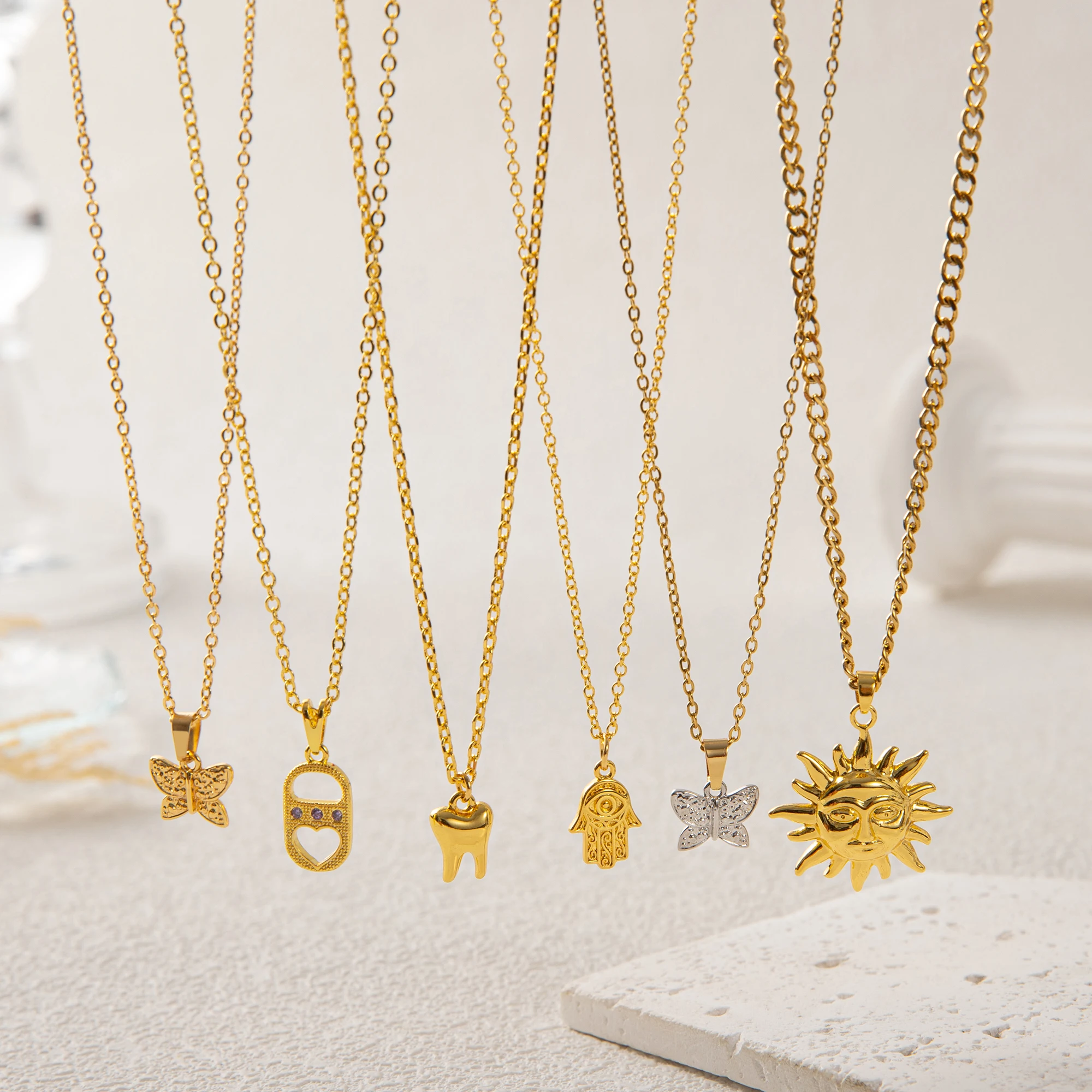 

18K Gold Plated Hamsa Hand Necklace with Zircon Heart, Butterfly & Sun Charms | Color Retention Jewelry for Women