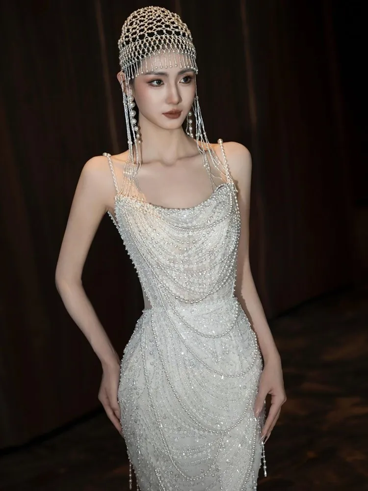

A niche and light luxury pearl halter dress with slender fish tail to welcome guests