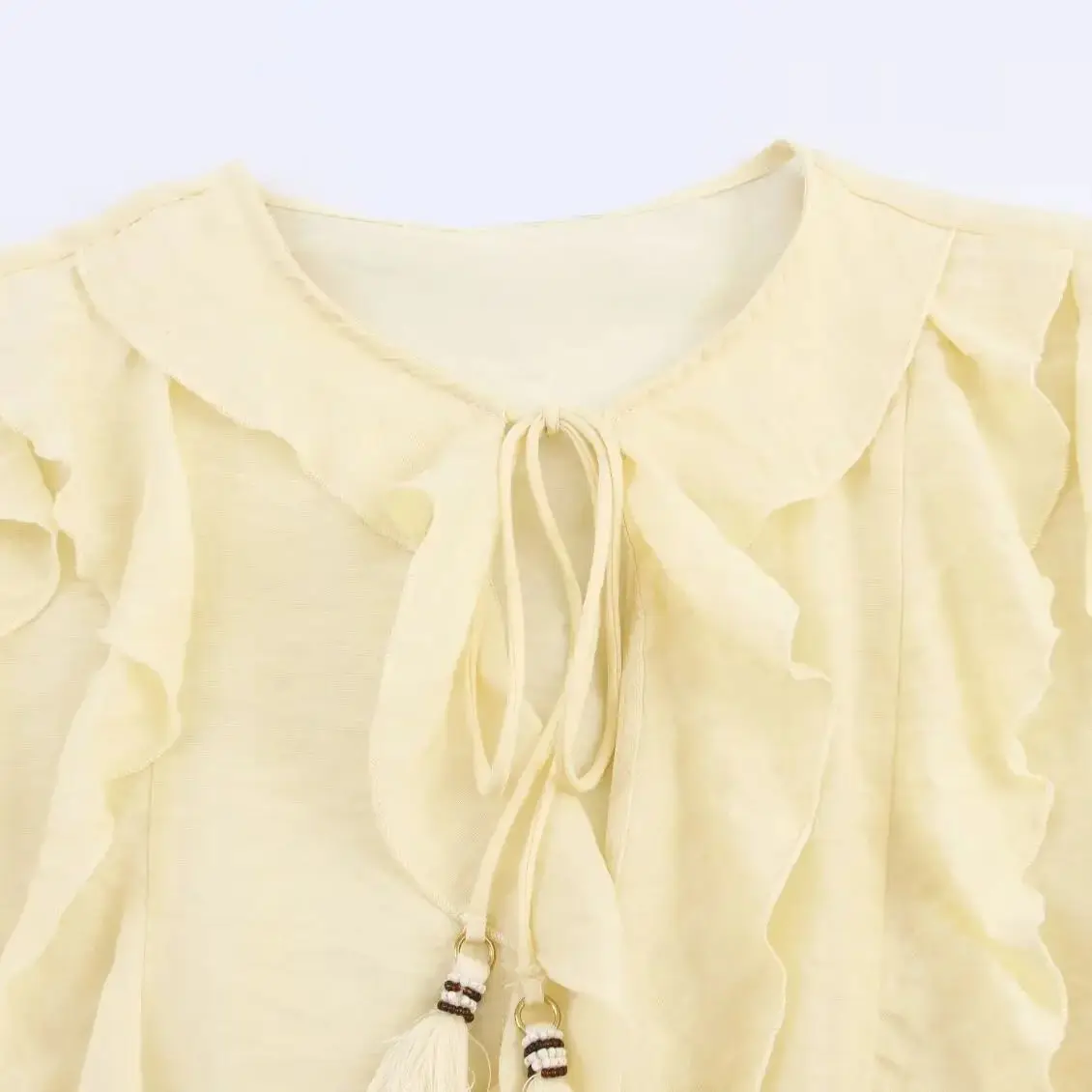 เสื้อแฟชั่นผู้หญิงสไตล์ยุโรปและอเมริกา ประจำปี 2025 รุ่นใหม่สำหรับฤดูใบไม้ร่วง ตกแต่งพู่เก๋ไก๋ คอกลม แต่งลายเคลือบ