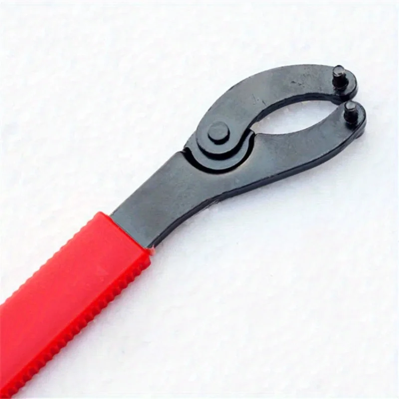 

Figure-8 Bike Wrench – Durable iron, red handle. Multi-tool for axle gear repair. Essential for bike maintenance.