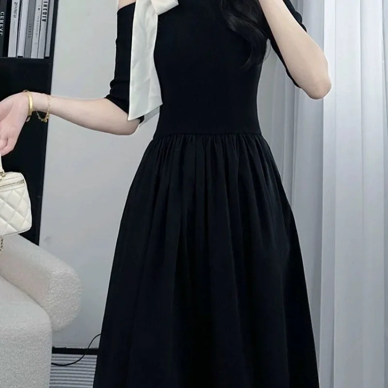 French bow black dress 2024 summer new fashion Joker loose off-the-shoulder waist temperament Hepburn style skirt