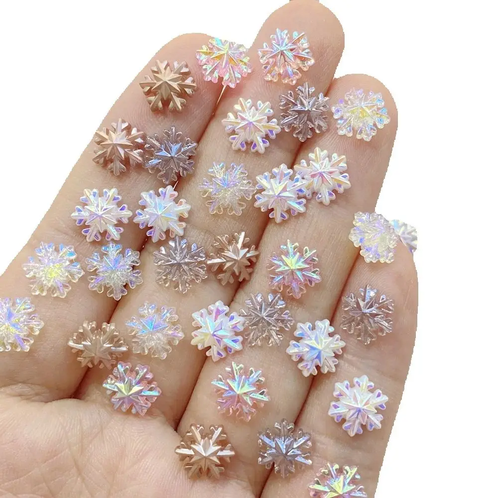 100 Stück niedliche Cartoon-Mini-Schneeflocken, farbige Nagelkunst-Harz-Designer-Anhänger, DIY-Bastelbedarf für 3D-Nageldekorationen, Schmuck