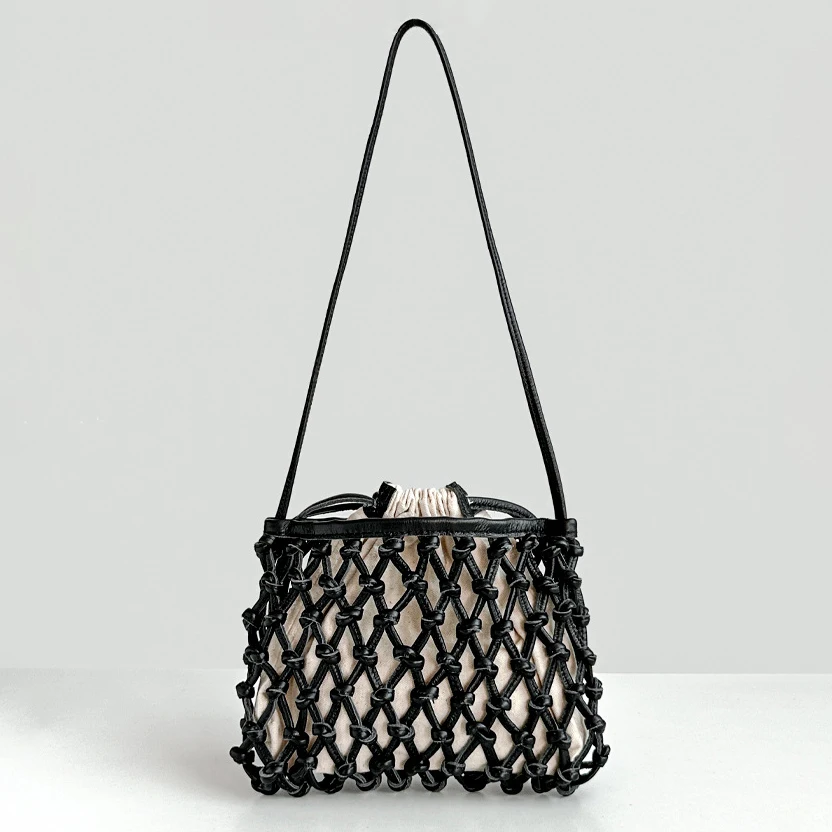 

Top layer cowhide hand-woven bag 2025 summer new niche design hollow French holiday beach bag women's one-shoulder crossbody bag