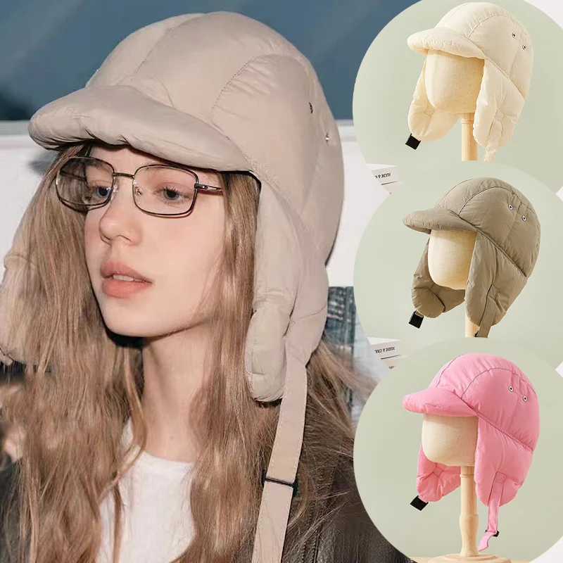 Модные зимние теплые шапки-бомберы