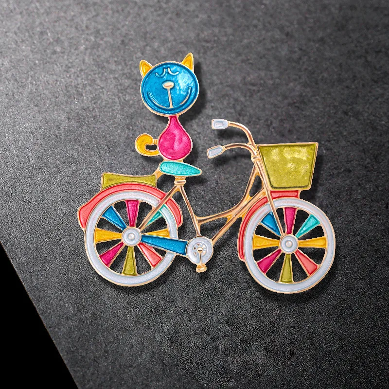 

Multicolor Enamel Cat Brooch Pins Decorative Props Sitting On Shopping Bike Cute Animal Badge New Year Jewelry Accessories Gift