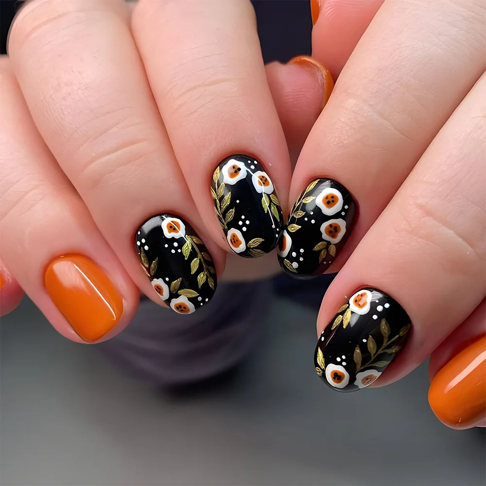 

24pcs Solid Orange Press-On Nails with Black Base and White Floral Botanical Pattern, Short Oval Shape, Assorted Sizes