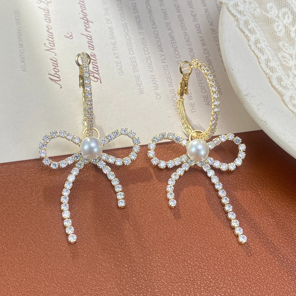 Personality exaggerated full zirconium big bow earrings femininity fashion light luxury super flash ear buckle