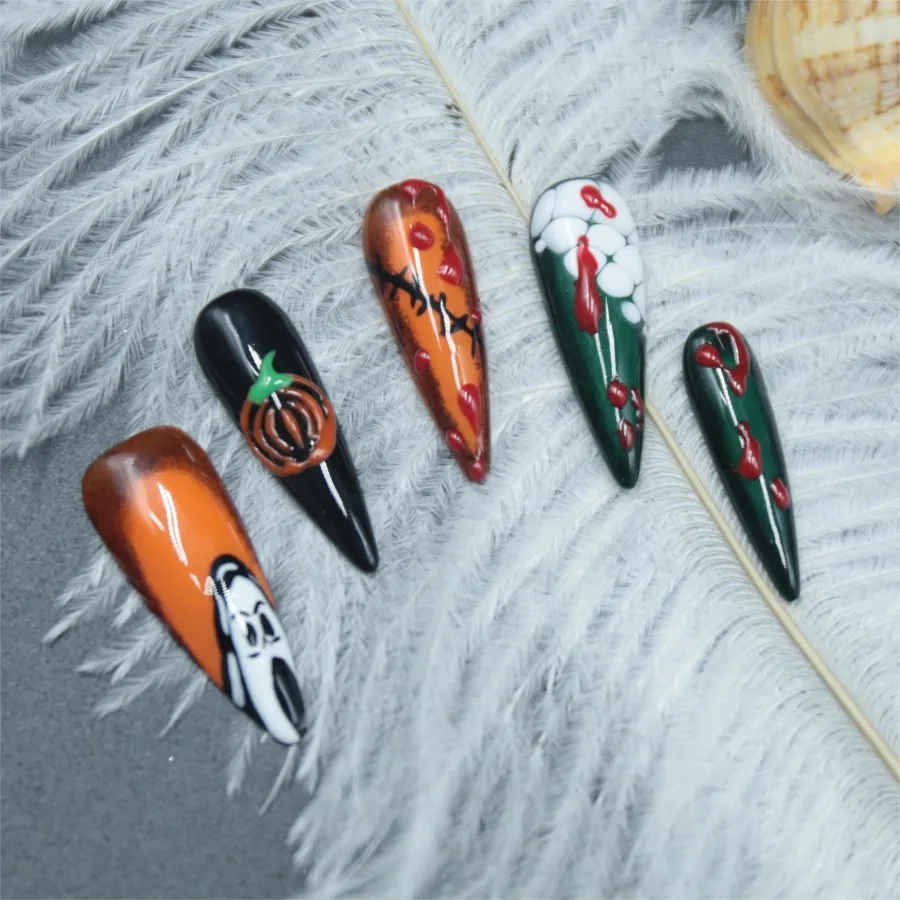 Handmade pressed fake nails, pumpkin Halloween elements, adhesive fake nails, long pointed styles, finished nail art,