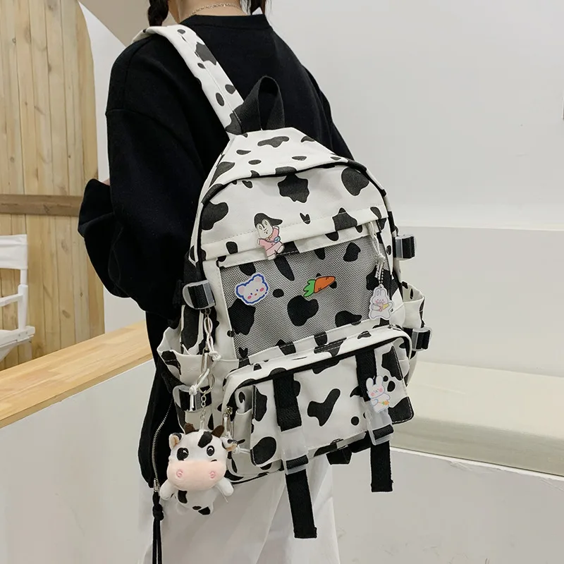 Mochila escolar con patrón de vaca para niña, mochila divertida de gran capacidad para campus, versión coreana, mochila de lona para estudiantes