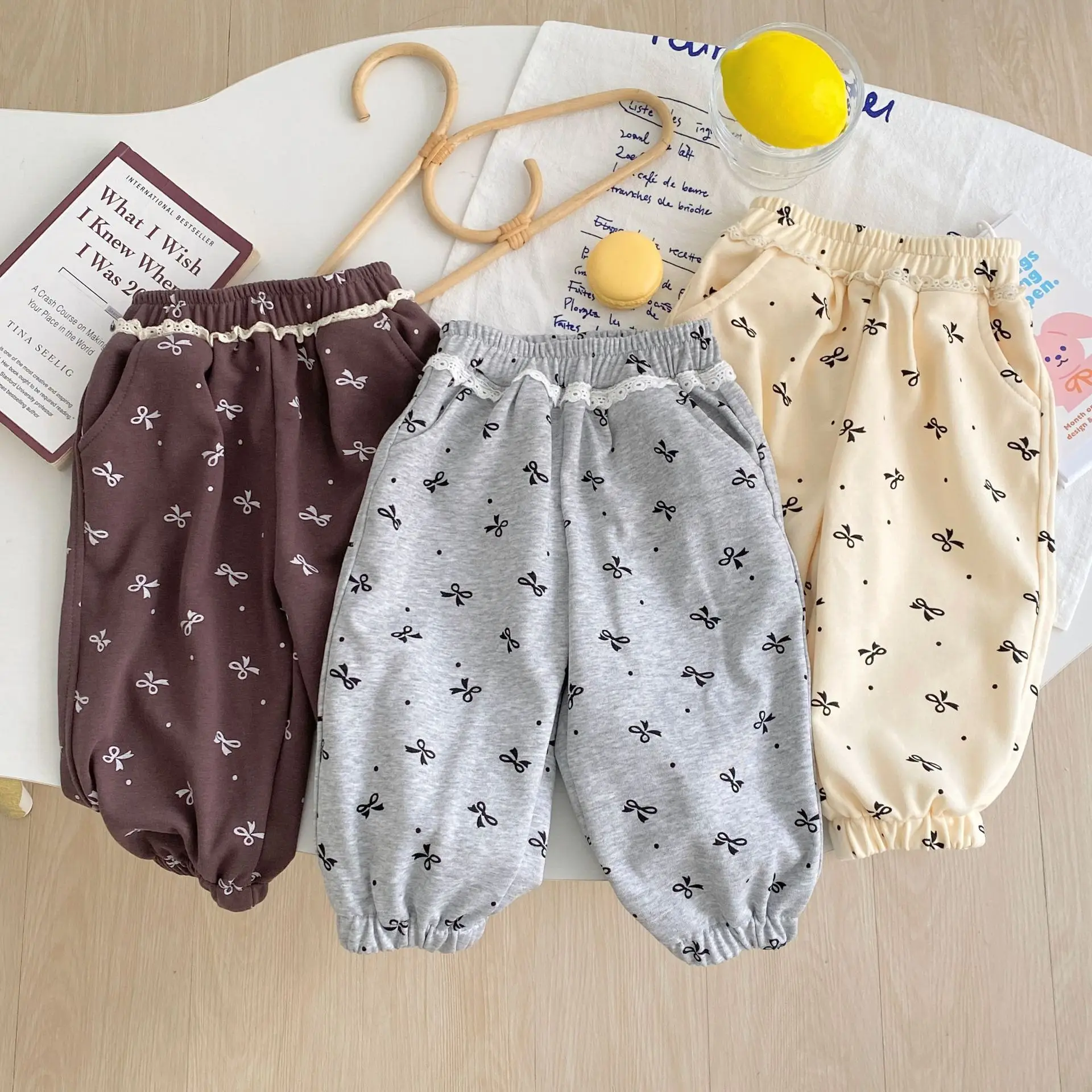 2025 children's trousers autumn new Korean version loose version boys and girls solid color casual bow pants baby leggings