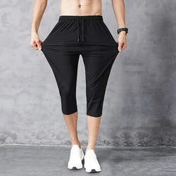 Erkekler spor kırpılmış pantolon rahat ince gevşek 3/4 kapri pantolonlar yüksek kaliteli spor koşu Sweatpants yedi noktalı Homme