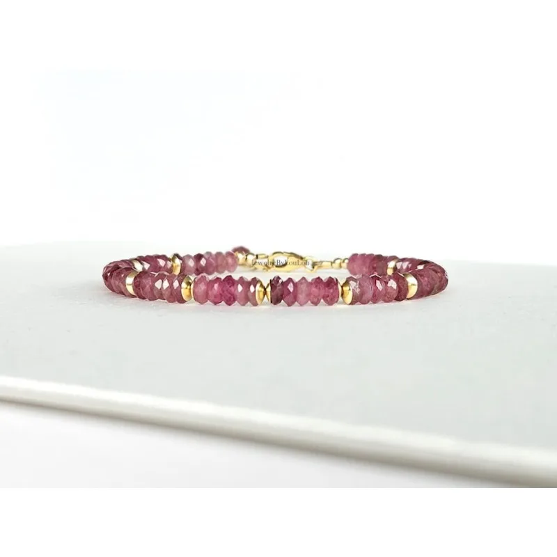 A bracelet with multiple smooth tourmaline gemstone beads