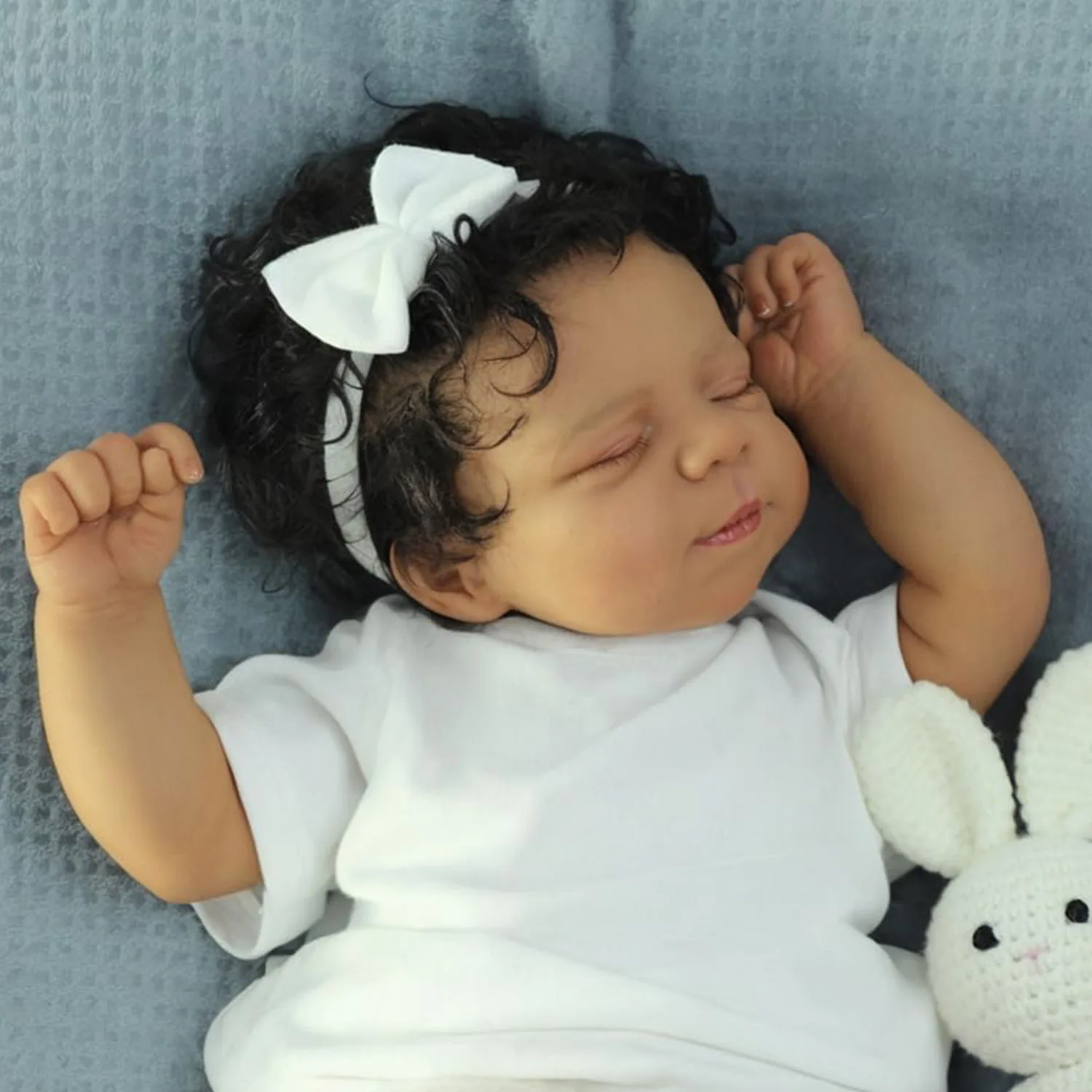 

Pascale Dark Skin 19'' Soft Cloth Body Reborn Sleeping Baby Doll Multiple Layers Painting 3D Skin With Hand Rooted Curly Hair