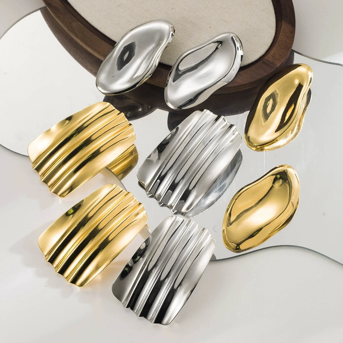 Exaggerated geometric irregular metal earrings, fashionable glossy pleated concave-convex design ear accessories