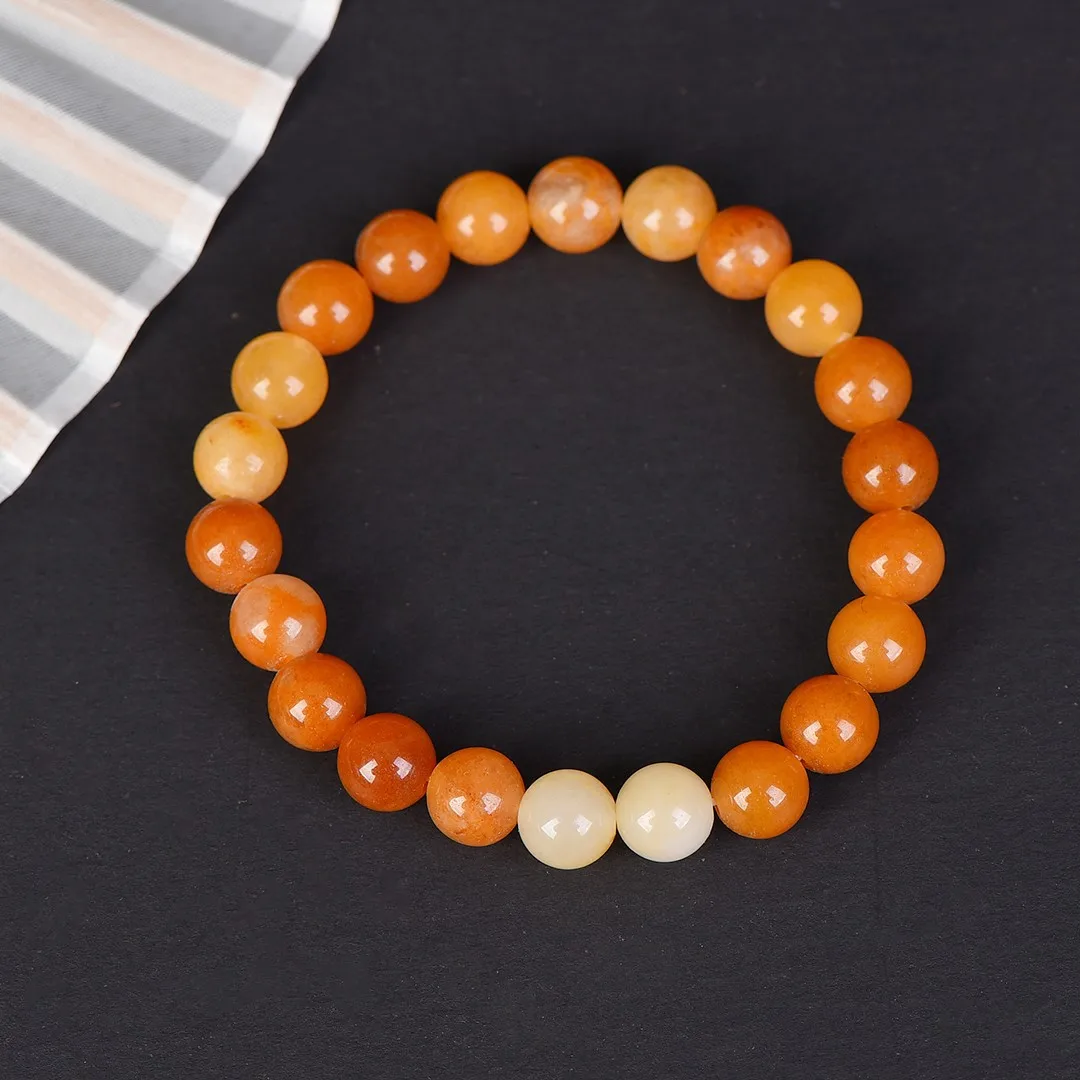 

Natural Xinjiang gold silk jade bracelet round bead yellow jade color men and women with the same jade versatile