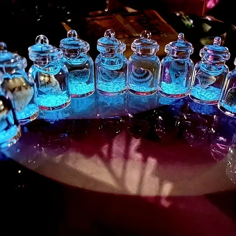 محارات مضيئة في زجاجات زجاجية شفافة، زجاجة انجراف على شكل محارة نجم البحر المحيطي مناسبة لعيد الميلاد ورأس السنة الجديدة