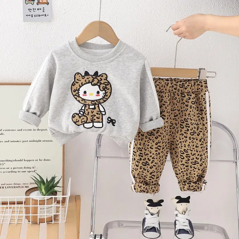 2025 Boutique de primavera Trajes para niñas Diseñador de dibujos animados Lindo Estampado de leopardo Camisetas de manga larga Pantalones Conjuntos de dos piezas Chándales para niños