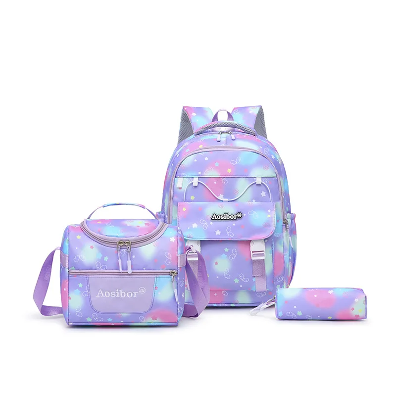 

Three-piece set of primary school schoolbags for women's new cartoon printing materials, junior high school schoolbags