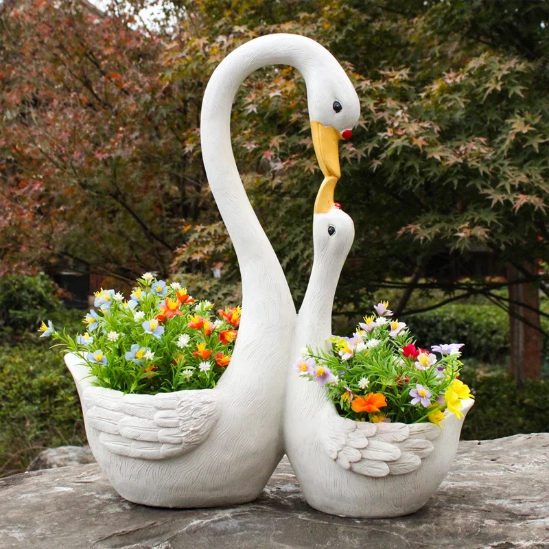 

Outdoor courtyard landscaping arrangement White swan shape flower pot Kindergarten cartoon animal flower tank Garden decoration