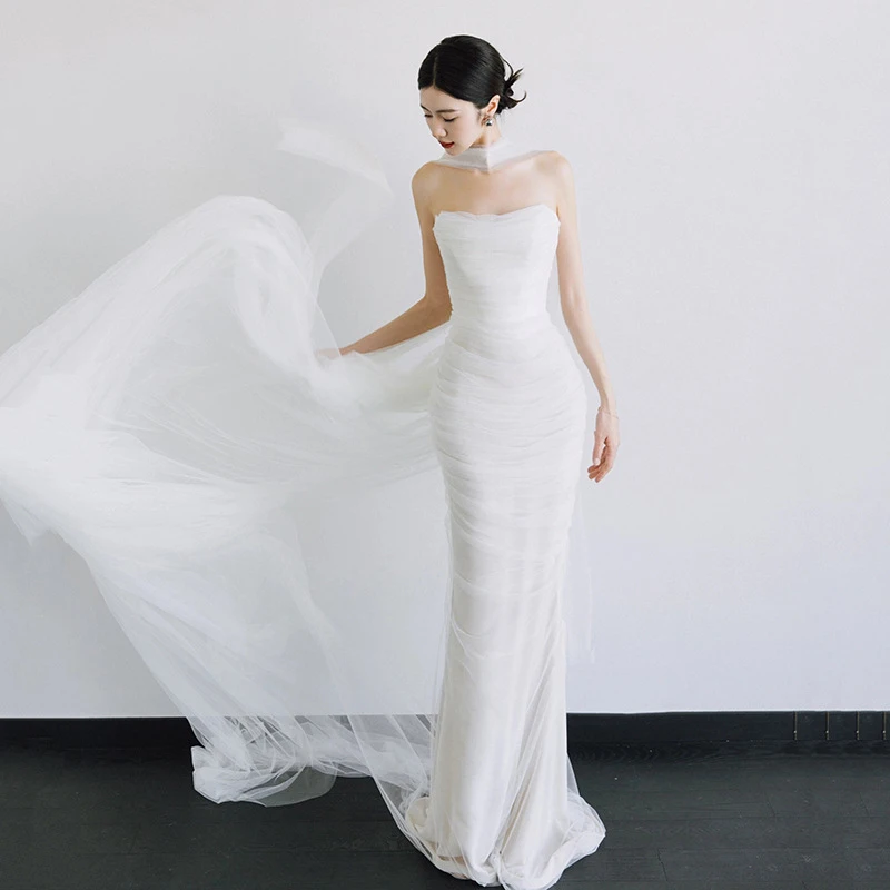 French-style strapless light wedding dress with a high-end, simple satin finish, elegant bridal dress for welcoming guests, whit