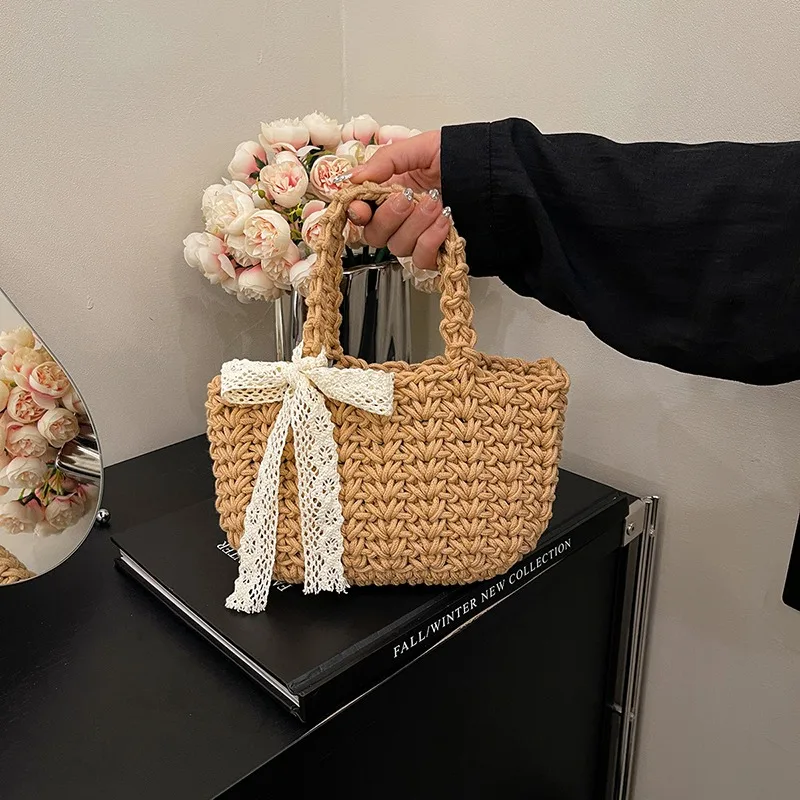 

Fabric Hollow Out Casual Top-Handle Bags Solid Bow Beach Female Bags on Sale 2025 Brand High Quality Fashion Versatile Handbags