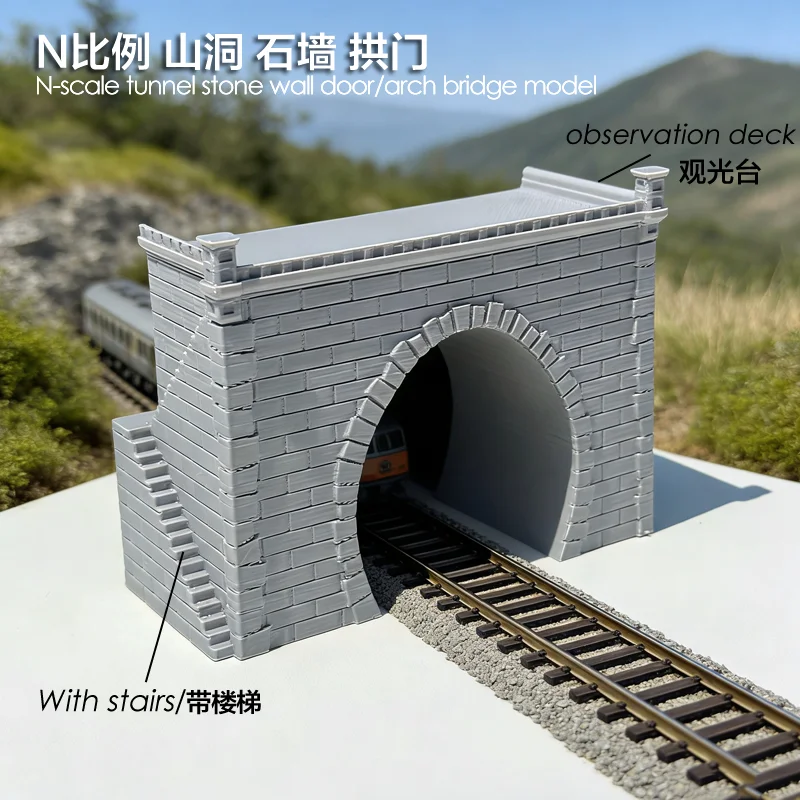 

Модель железнодорожной трассы в масштабе 1/160 N: вход/выход из пещеры, каменная стена, имитация средневекового арочного моста с лестницей, пластиковые городские ворота