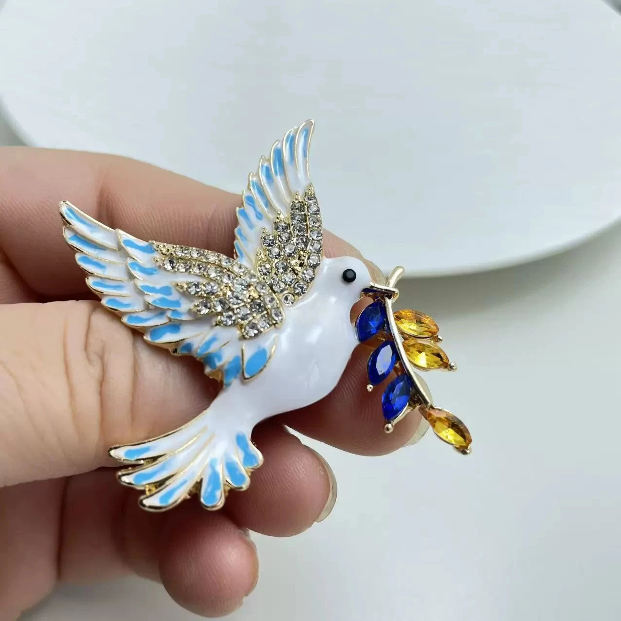 Wholesale of Alloy Enamel Peace Dove Brooch with Dripping Oil Crystal Chest Flower Pin
