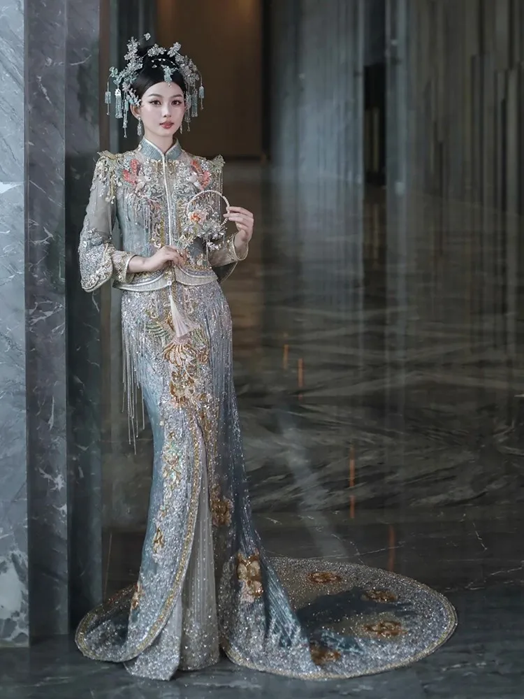 A new fish-tail style toasting Chinese-style knot with trailing tail and phoenix-crowned robe